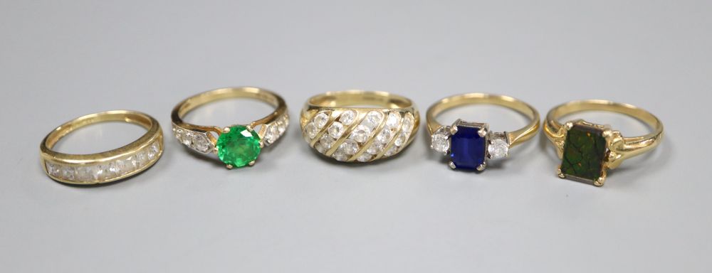 Five assorted 585 gold dress rings, one opal-set, the others paste-set, gross 13.4 grams.